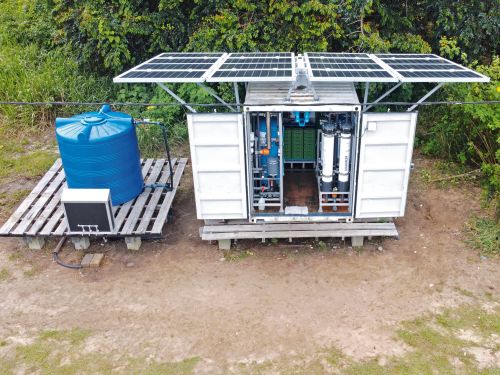 Water treatment system in a container with solar panels on the roof