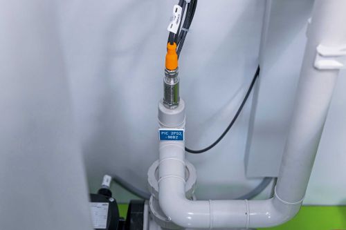 Compact pressure sensor in a small plastic pipe.