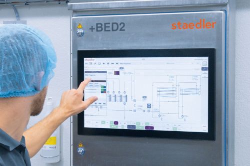 Employee operating the system via a touch screen